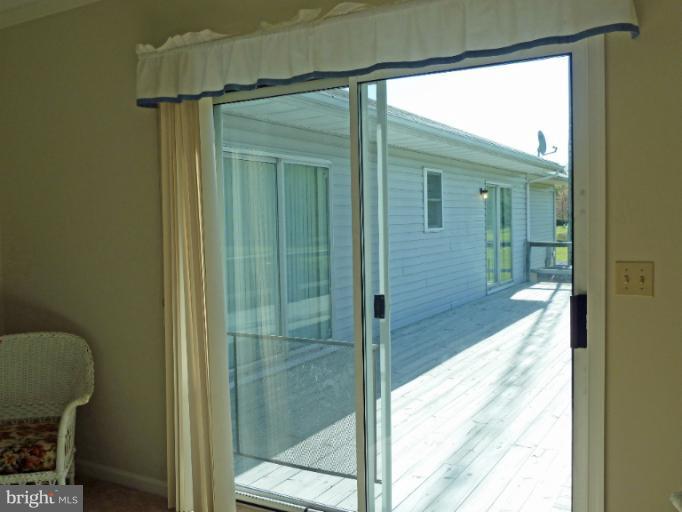 1020 Wagner Point Road Cambridge, MD 21613 - Photo 1 of 26 Sunroom onto the deck