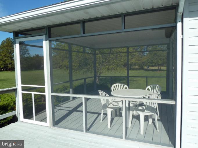 1020 Wagner Point Road Cambridge, MD 21613 - Photo 17 of 26 Deck into Screened Porch