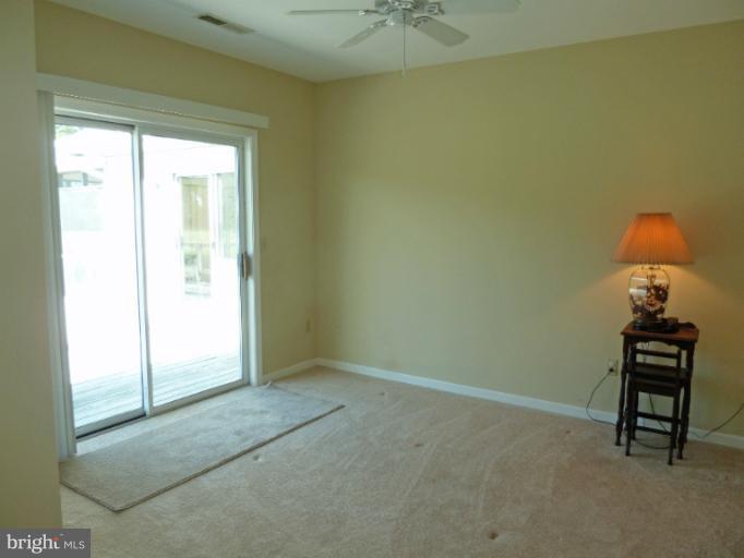 1020 Wagner Point Road Cambridge, MD 21613 - Photo 24 of 26 Bedroom 2 with sliding door to deck