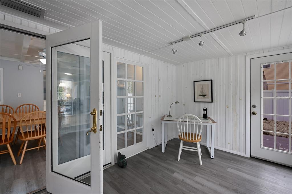 120 Maple Avenue Anna Maria, FL 34216 - Photo 23 of 39 a view of a room with furniture and wooden floor