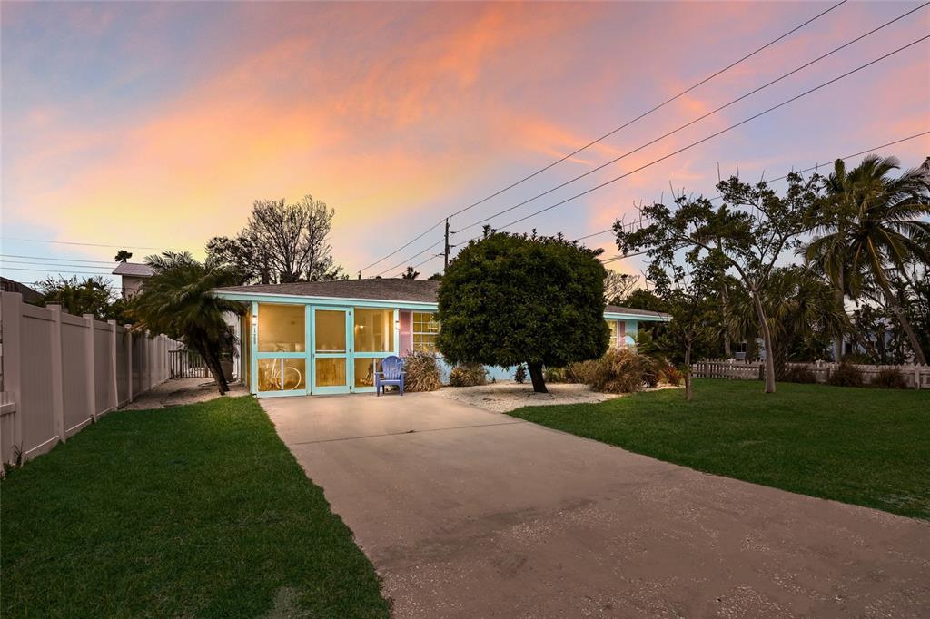 120 Maple Avenue Anna Maria, FL 34216 - Photo 39 of 39 a front view of a house with a yard and trees