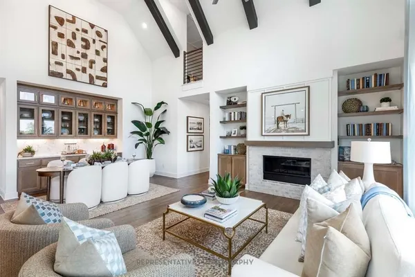 a living room with furniture a fireplace and decor