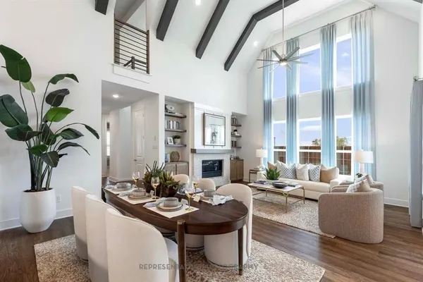 a living room with furniture potted plant and a large mirror