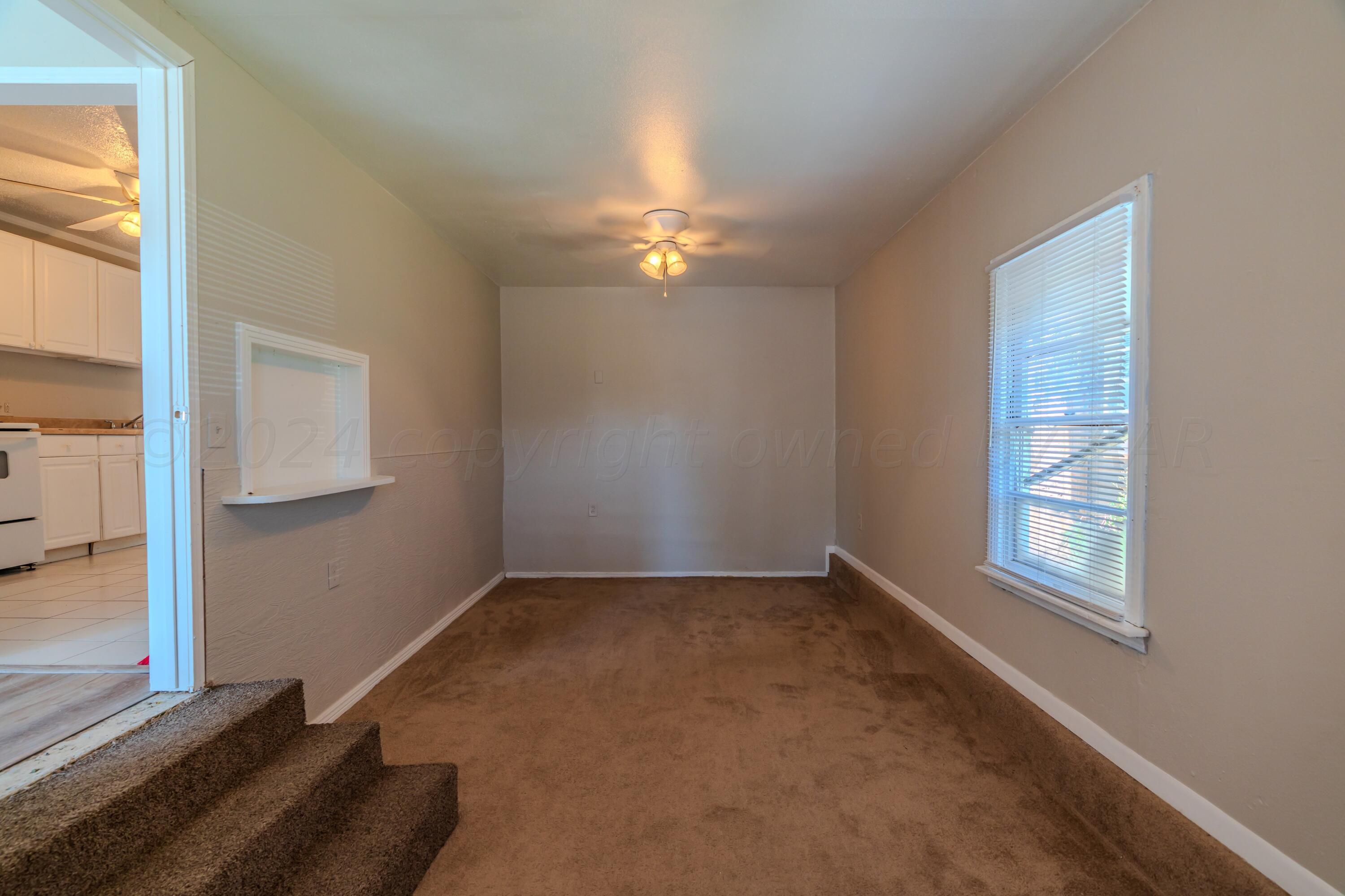 4116 Gables Street Amarillo, TX 79110 - Photo 12 of 13 an empty room with windows and closet