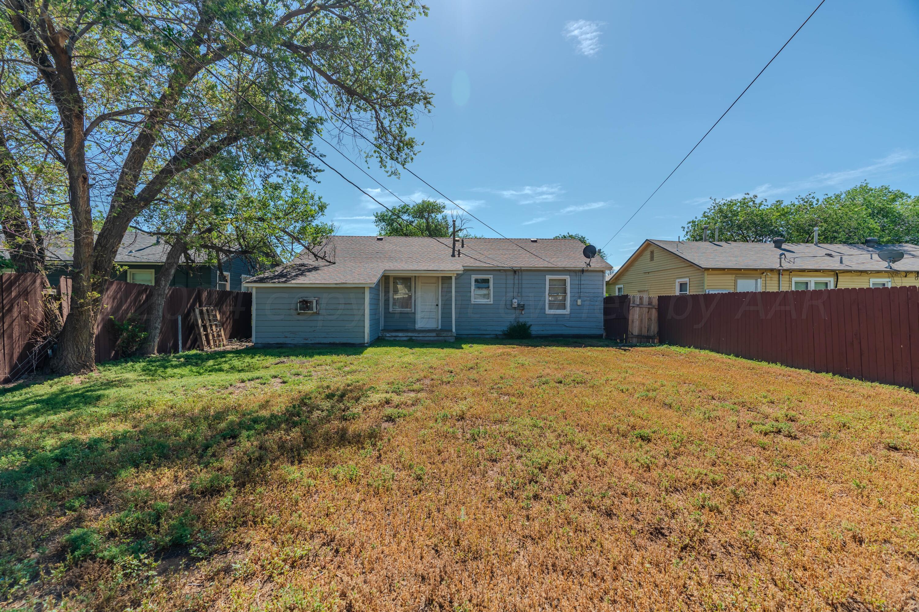 4116 Gables Street Amarillo, TX 79110 - Photo 13 of 13 a front view of a house with a yard