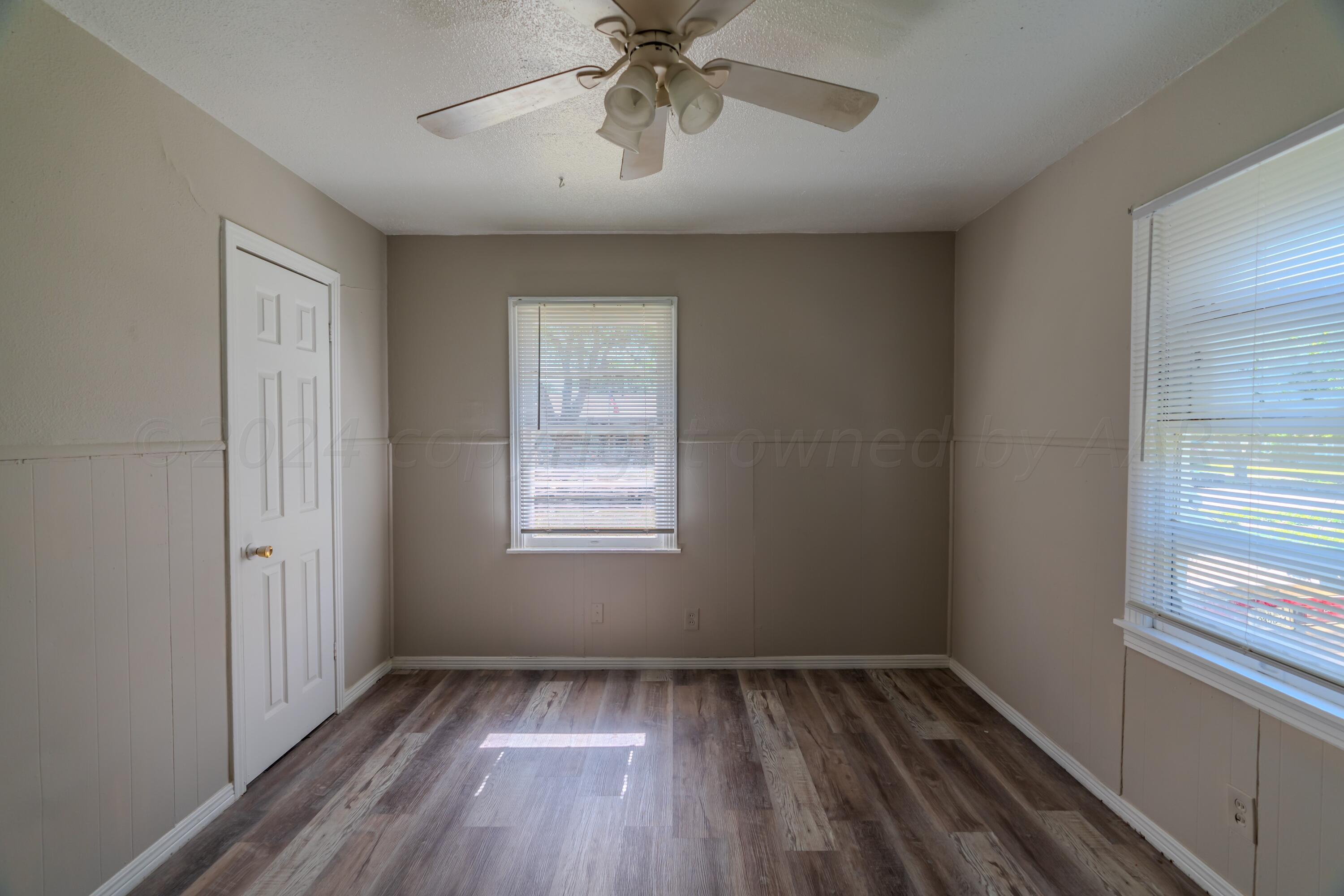 4116 Gables Street Amarillo, TX 79110 - Photo 10 of 13 a view of an empty room with a window