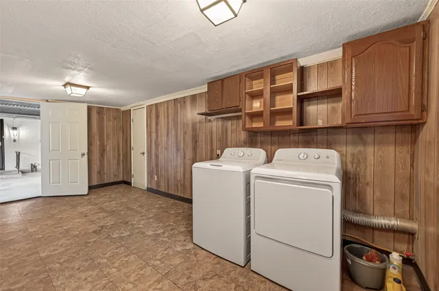 a view of storage and utility room with washer and dryer