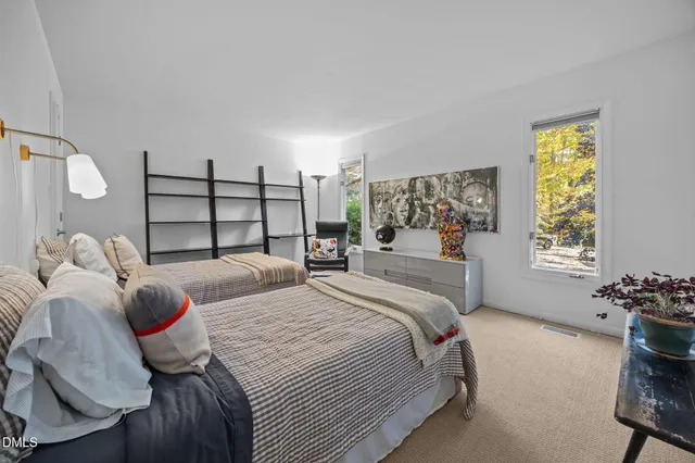 a bedroom with a bed and window