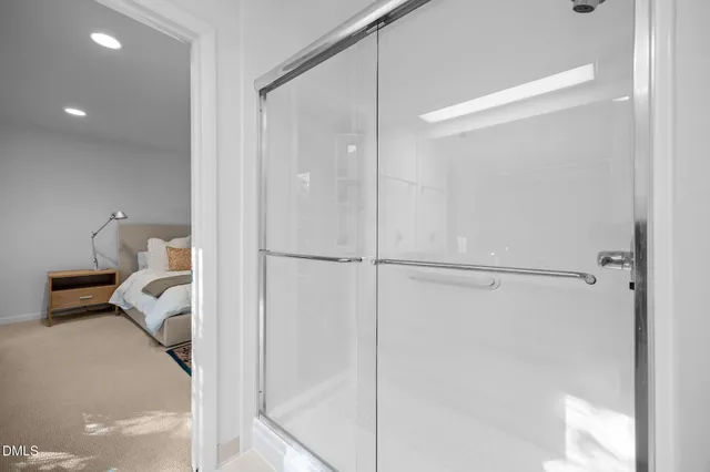 a en suite bathroom with a shower and a tub