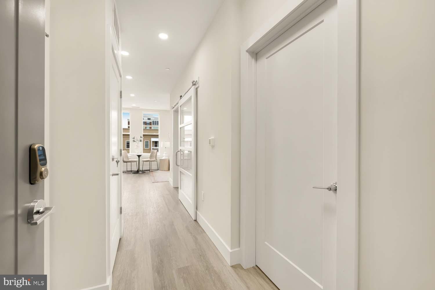 2005 11th Street Northwest, Unit 502 Washington, DC 20001 - Photo 19 of 20 Modern hallway leading to inviting spaces.