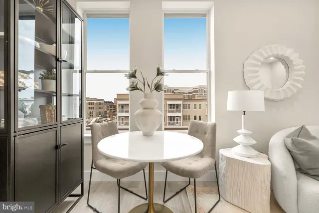 a dining room with furniture and window