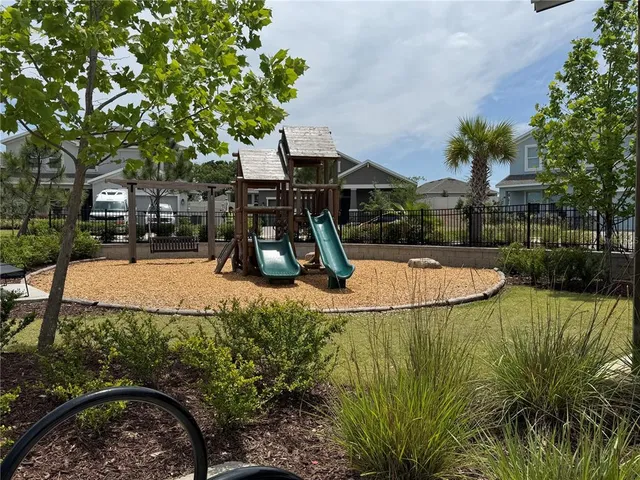 a view of a backyard with swimming pool