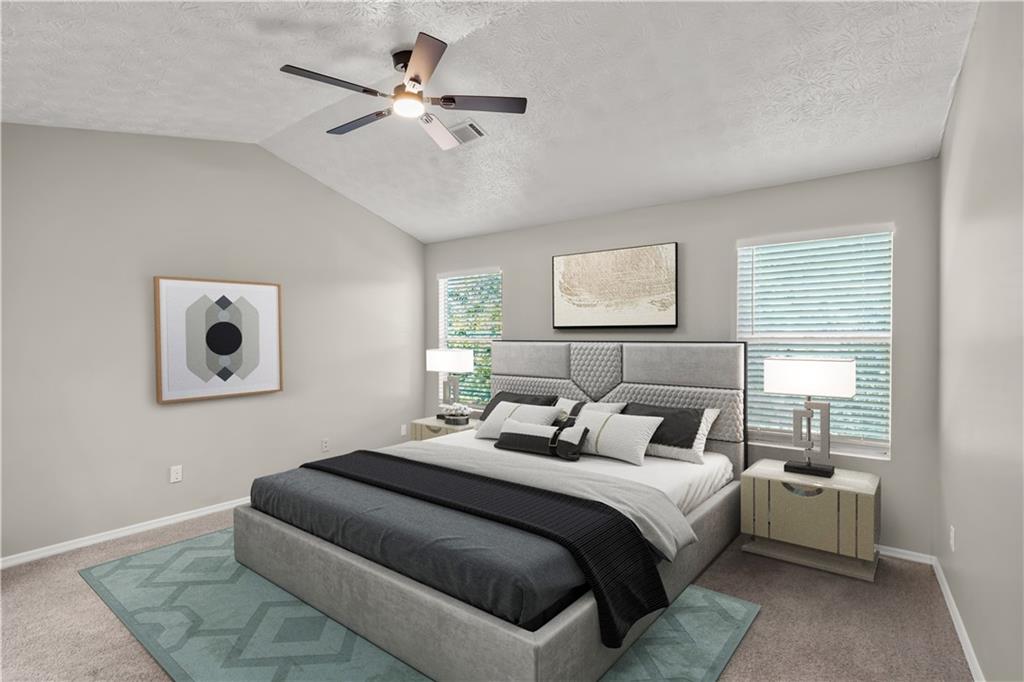 826 Shore Drive Lithonia, GA 30058 - Photo 23 of 42 a bedroom with a bed and a window