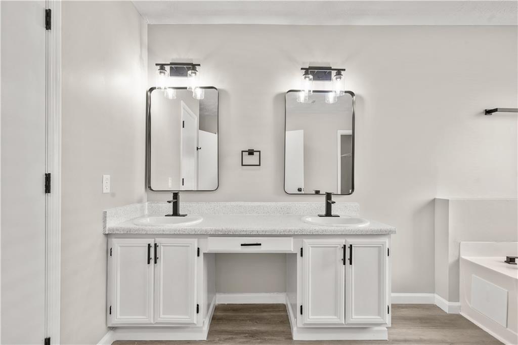 826 Shore Drive Lithonia, GA 30058 - Photo 28 of 42 a bathroom with a sink and a mirror