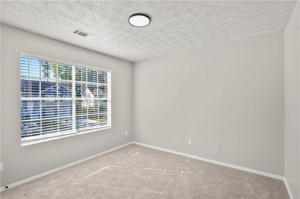 826 Shore Drive Lithonia, GA 30058 - Photo 33 of 42 an empty room with a window