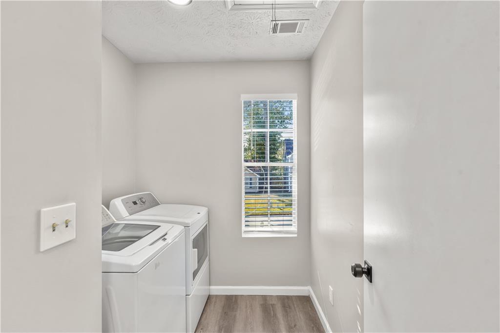 826 Shore Drive Lithonia, GA 30058 - Photo 34 of 42 a utility room with dryer and washer