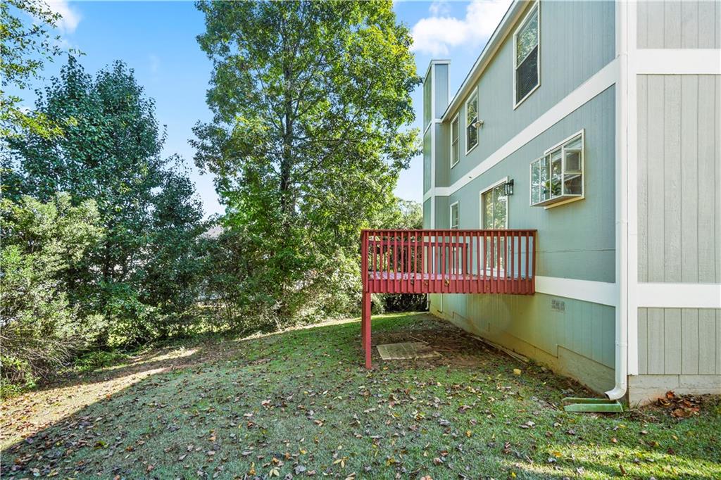 826 Shore Drive Lithonia, GA 30058 - Photo 36 of 42 a view of balcony with small garden and wooden fence
