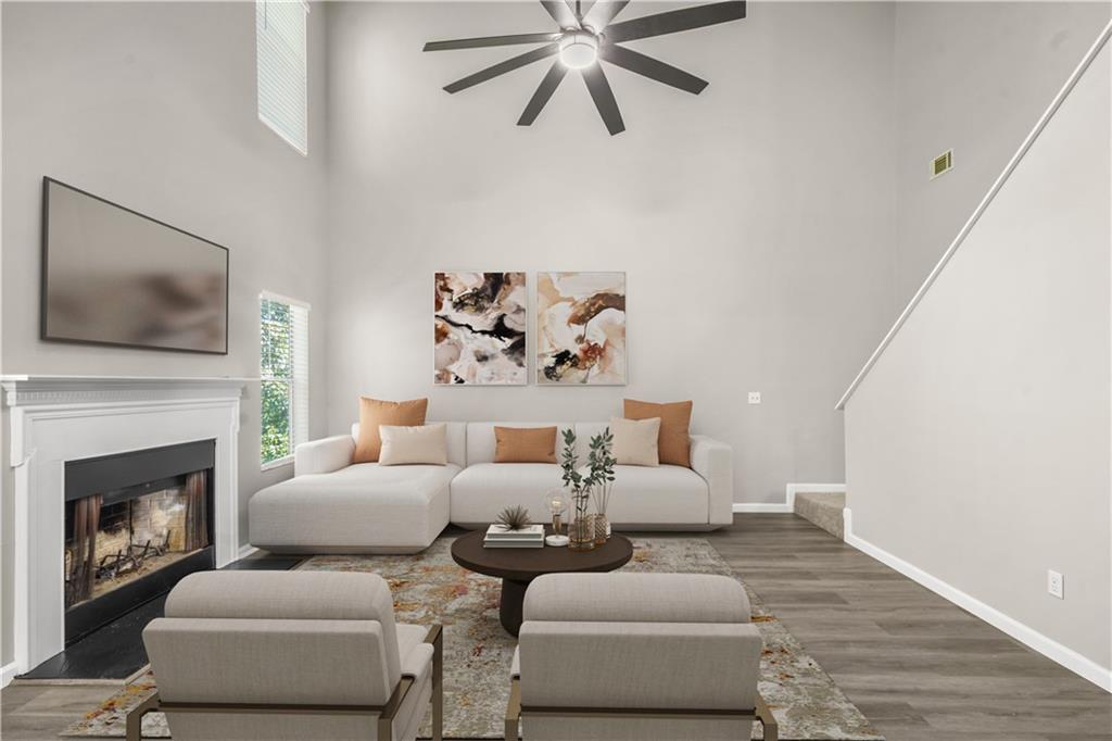 826 Shore Drive Lithonia, GA 30058 - Photo 4 of 42 a living room with furniture and a fireplace