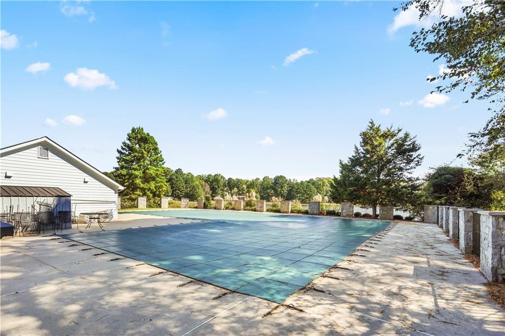 826 Shore Drive Lithonia, GA 30058 - Photo 41 of 42 a view of a lake with a yard