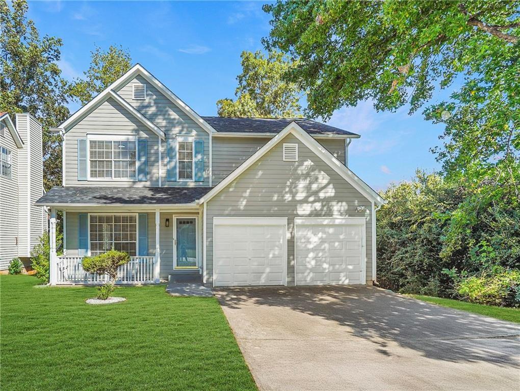 826 Shore Drive Lithonia, GA 30058 - Photo 42 of 42 a front view of a house with a yard