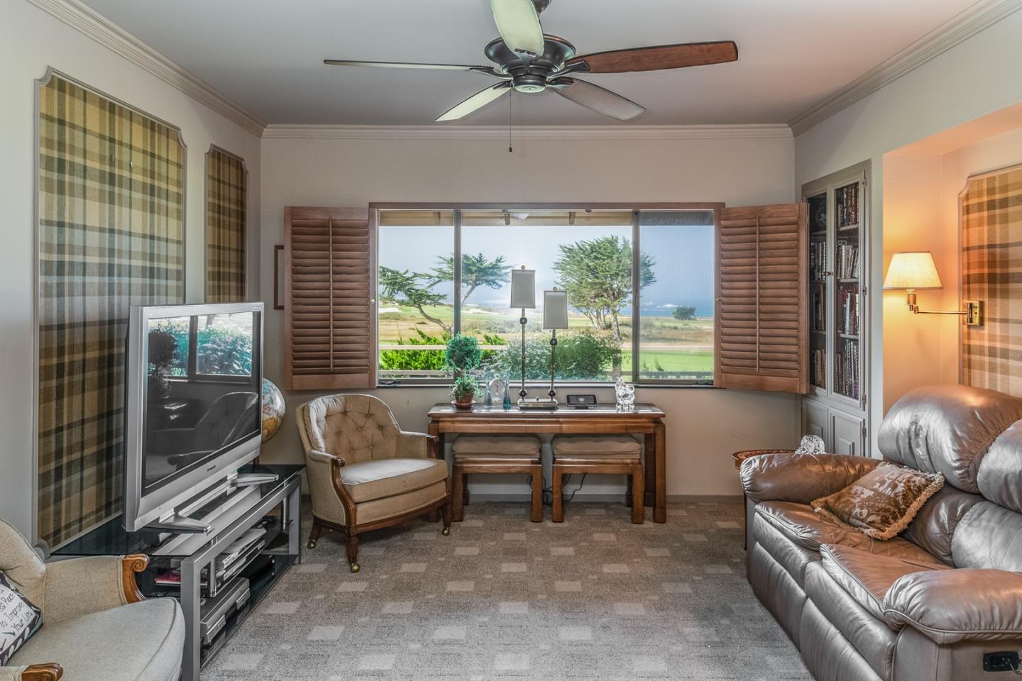 1020 Rodeo Road Pebble Beach, CA 93953 - Photo 11 of 38 a living room with furniture and a floor to ceiling window
