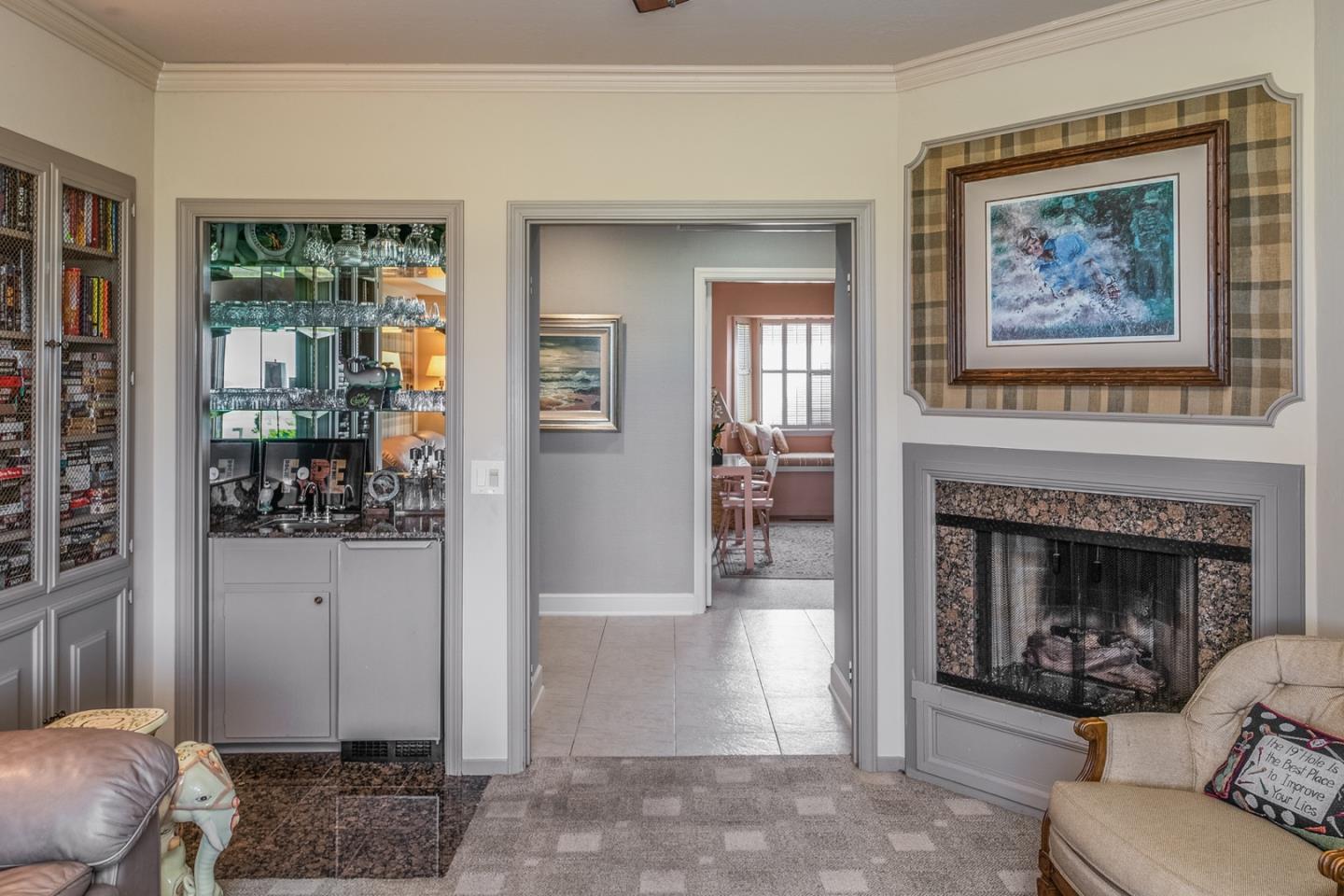 1020 Rodeo Road Pebble Beach, CA 93953 - Photo 12 of 38 a living room with furniture and a fireplace