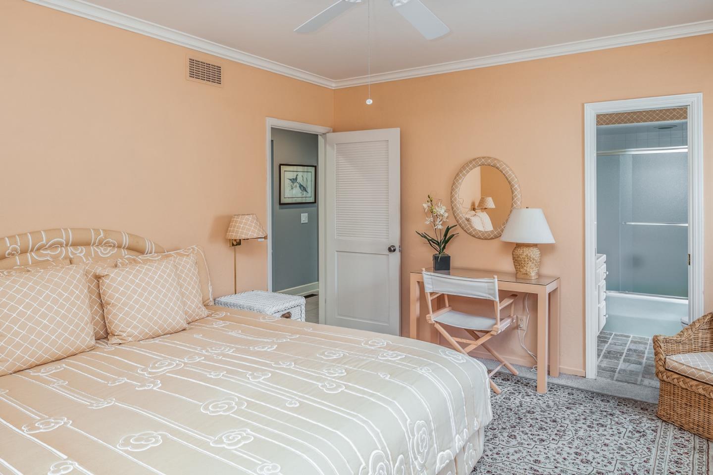 1020 Rodeo Road Pebble Beach, CA 93953 - Photo 13 of 38 a bedroom with a bed and a mirror