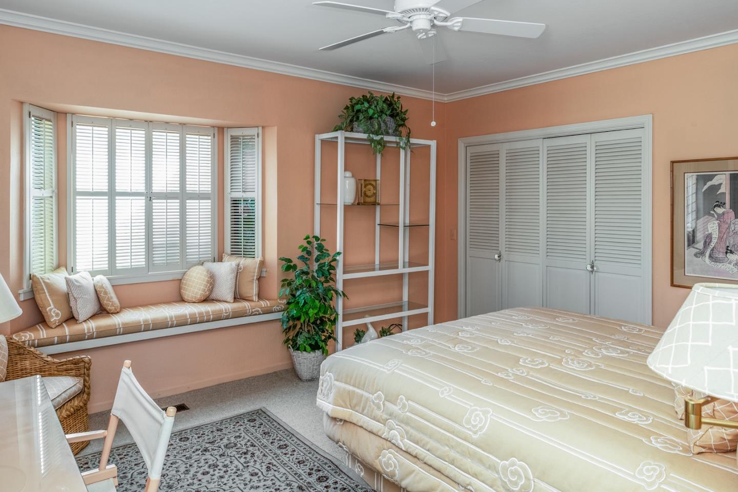 1020 Rodeo Road Pebble Beach, CA 93953 - Photo 14 of 38 a bedroom with a large bed and a couch