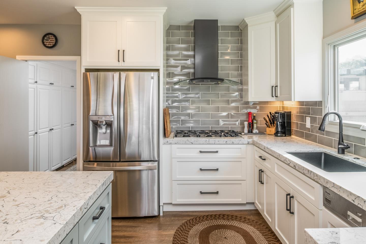 1020 Rodeo Road Pebble Beach, CA 93953 - Photo 23 of 38 a kitchen with a granite countertop appliances and a sink