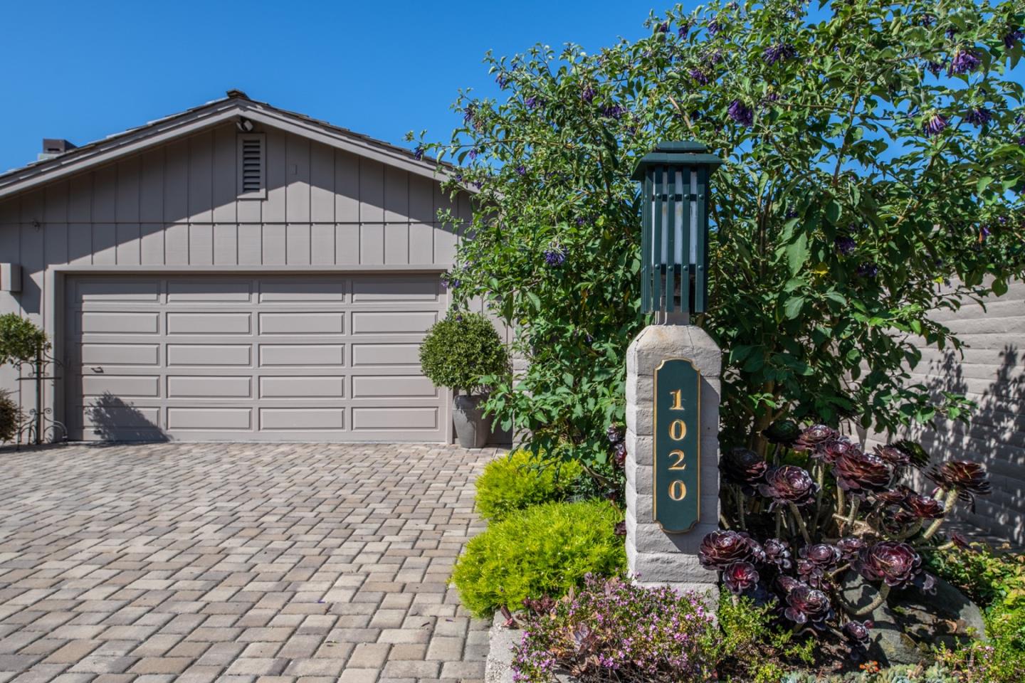 1020 Rodeo Road Pebble Beach, CA 93953 - Photo 5 of 38 a front view of a house with garden