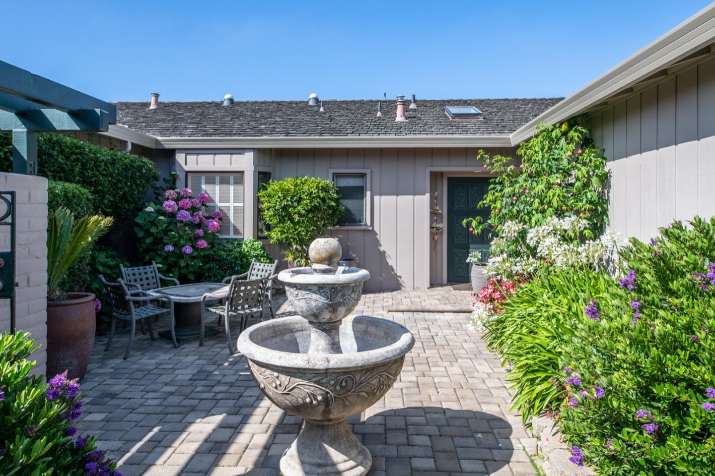 1020 Rodeo Road Pebble Beach, CA 93953 - Photo 6 of 38 a view of a backyard with plants and patio