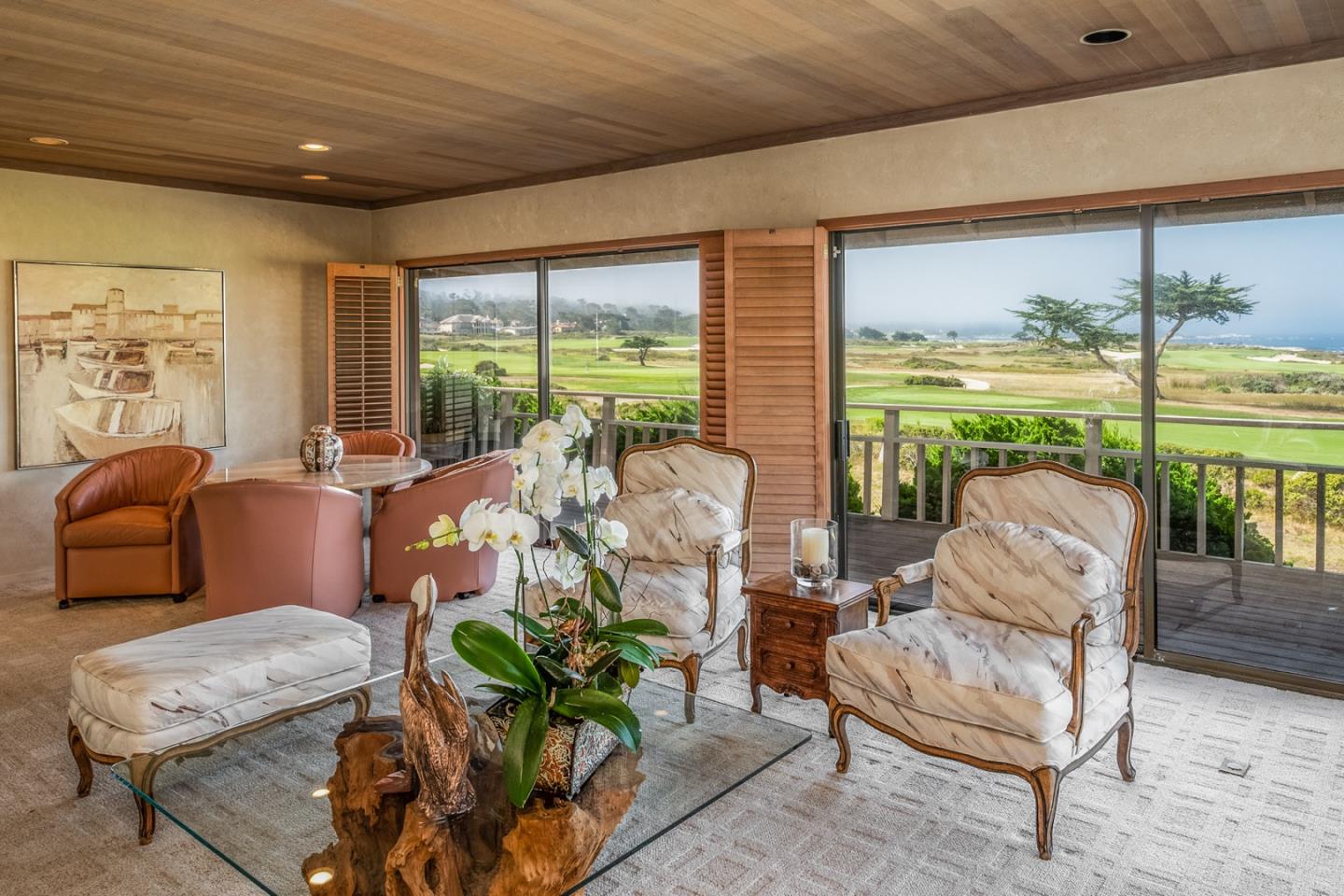 1020 Rodeo Road Pebble Beach, CA 93953 - Photo 8 of 38 a living room with patio furniture and a floor to ceiling window