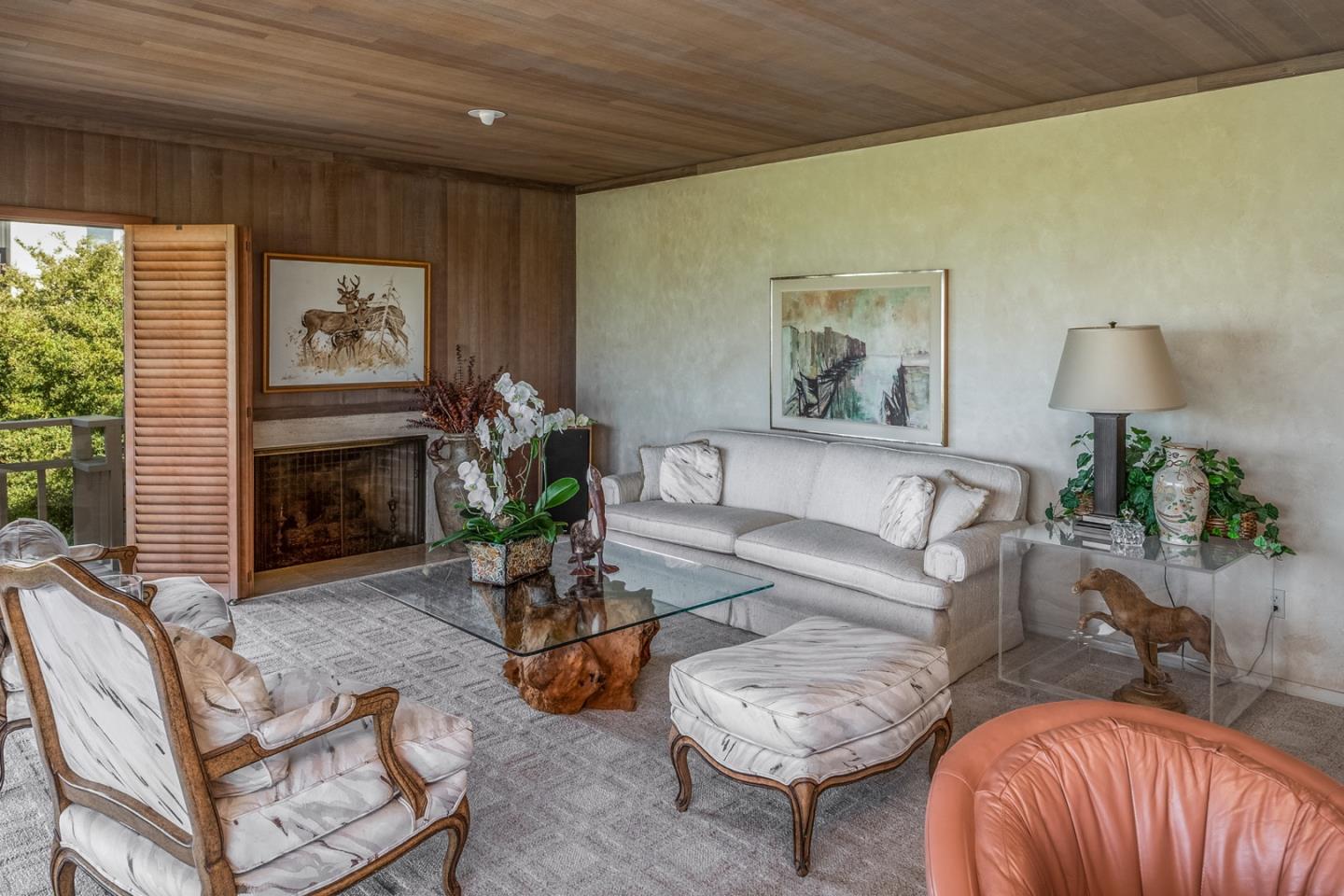 1020 Rodeo Road Pebble Beach, CA 93953 - Photo 9 of 38 a living room with furniture and a fireplace
