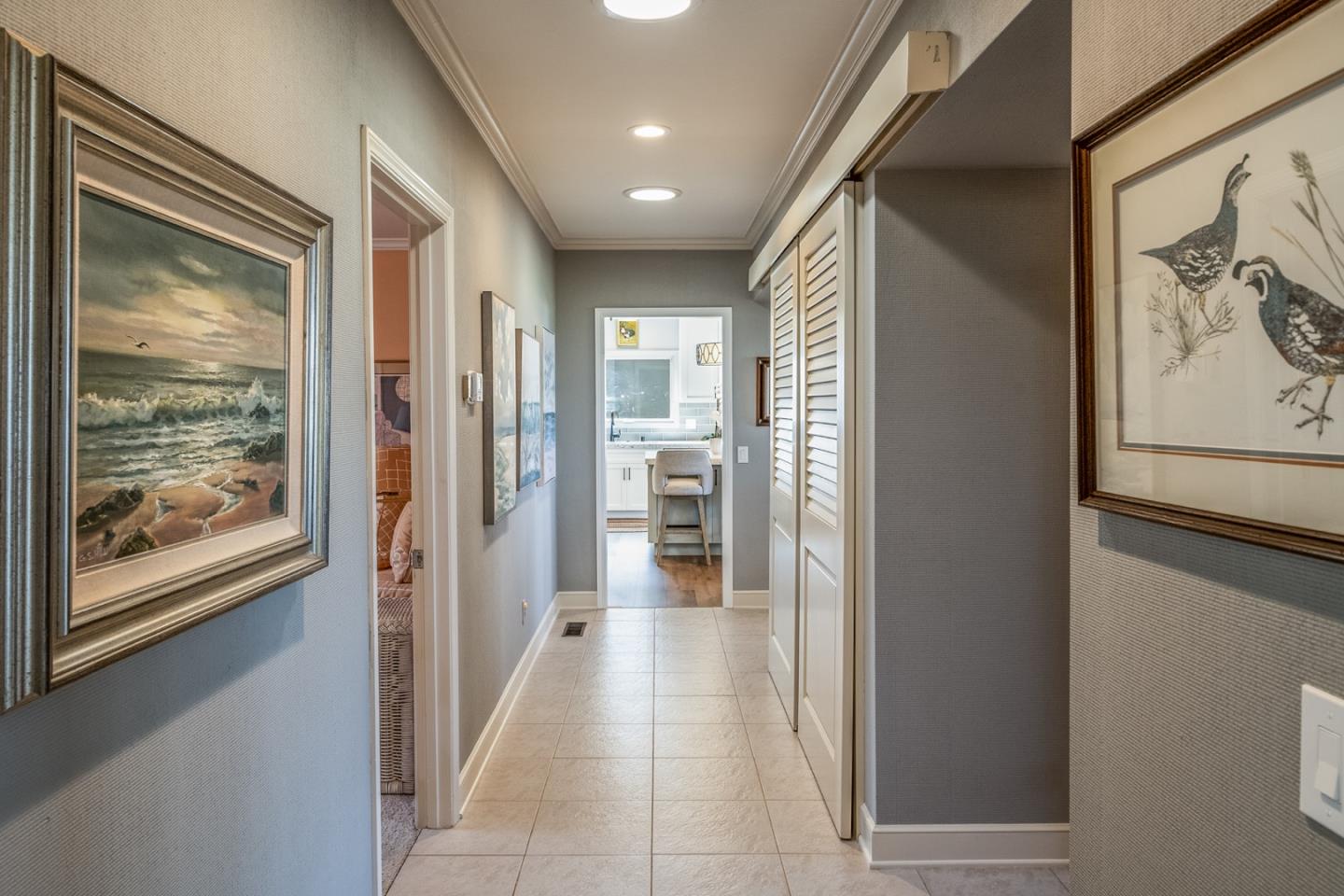 1020 Rodeo Road Pebble Beach, CA 93953 - Photo 10 of 38 a view of a hallway with wooden floor and windows