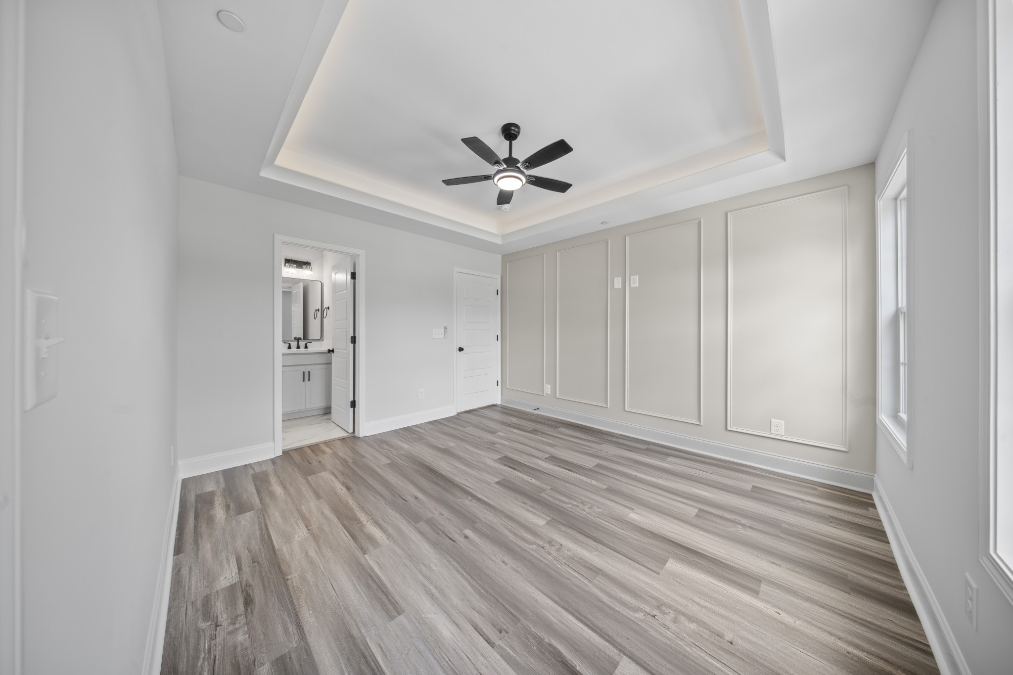 130 Gower Street Pleasant View, TN 37146 - Photo 16 of 30 wooden floor in an empty room with a ceiling fan