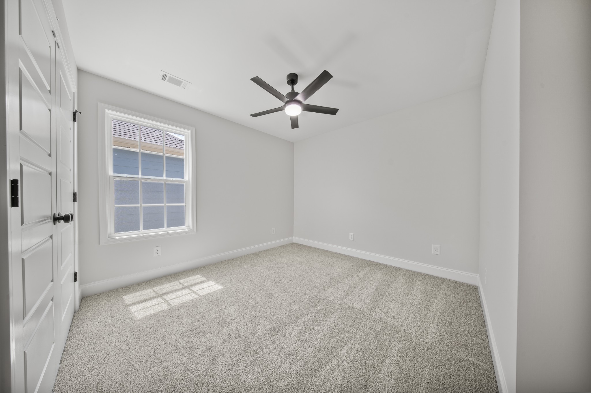 130 Gower Street Pleasant View, TN 37146 - Photo 22 of 30 an empty room with windows and fan