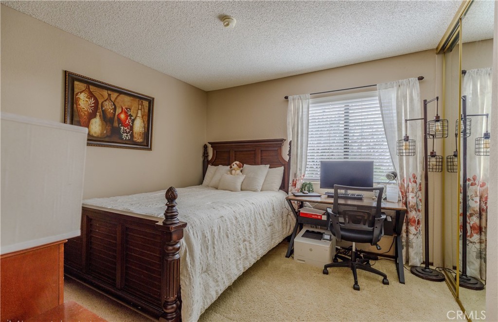 2124 Snowberry Court Simi Valley, CA 93063 - Photo 18 of 23 a bedroom with a bed and a desk