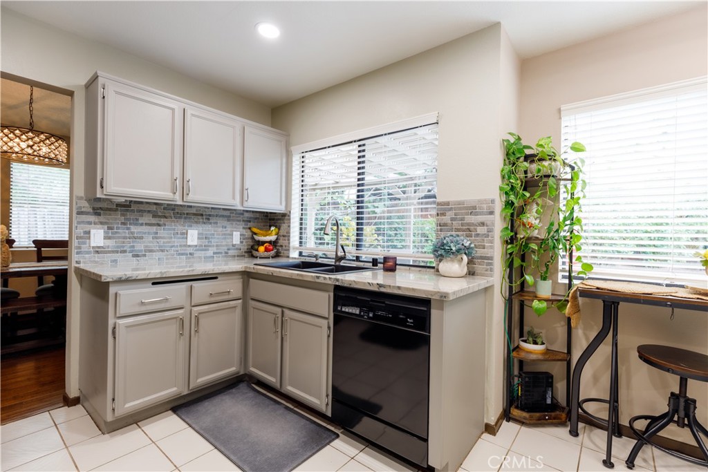 2124 Snowberry Court Simi Valley, CA 93063 - Photo 7 of 23 a kitchen with a sink stove and cabinets