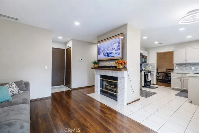 a kitchen with stainless steel appliances a stove a refrigerator and a oven