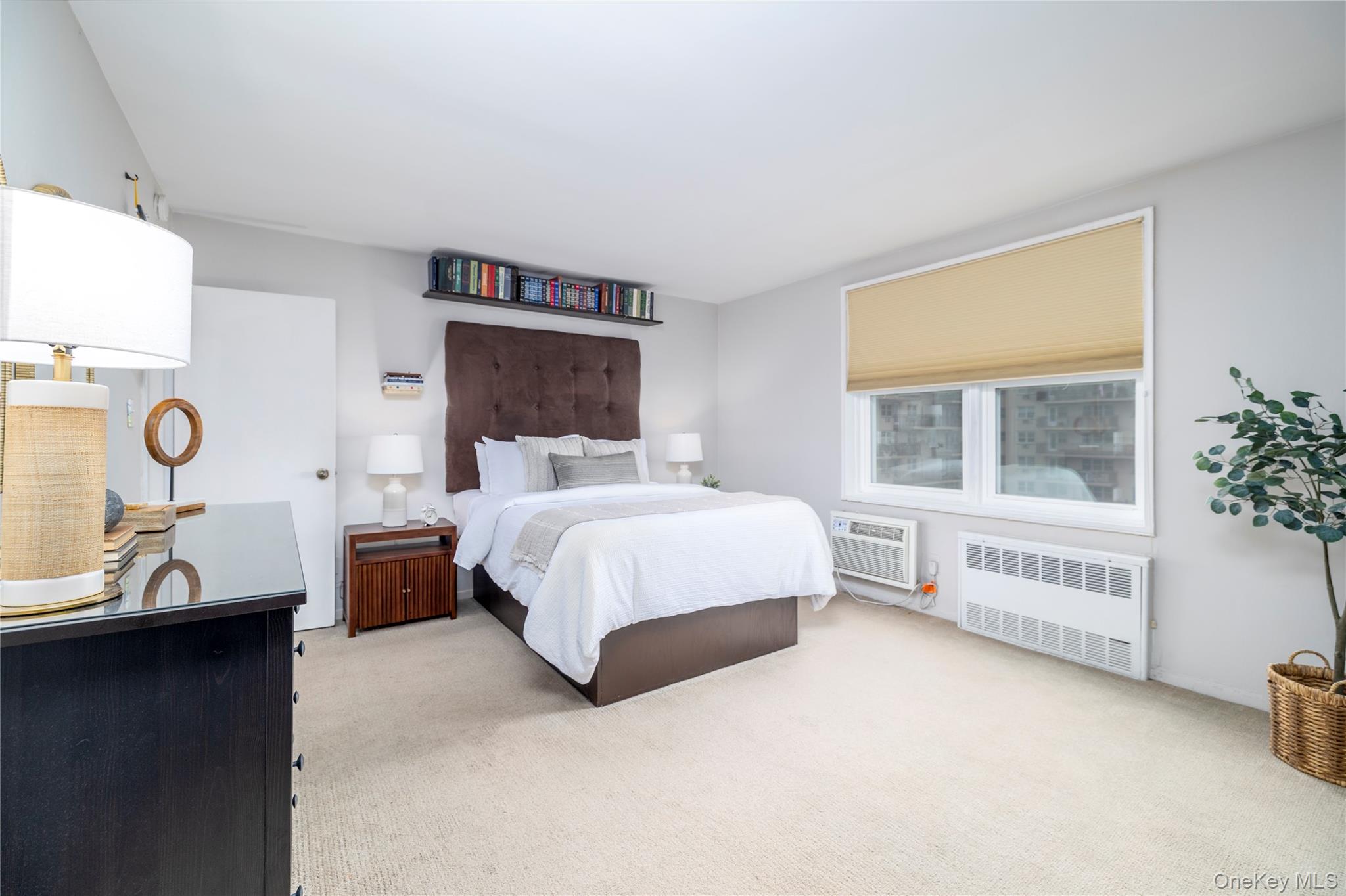 522 Shore Road, Unit 6C Long Beach, NY 11561 - Photo 13 of 25 a bed room with a bed and a window