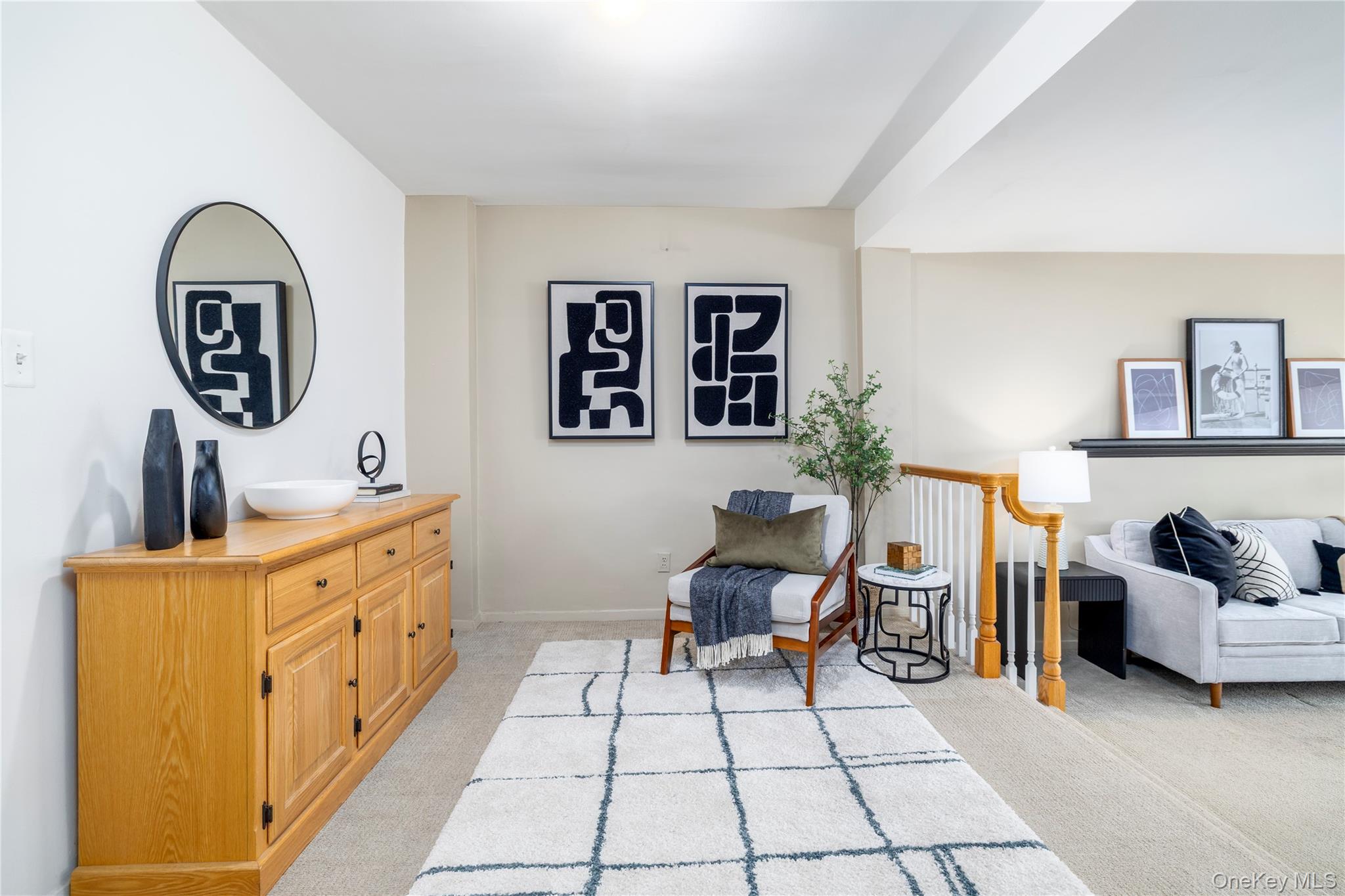 522 Shore Road, Unit 6C Long Beach, NY 11561 - Photo 6 of 25 a living room with furniture and a baby crib