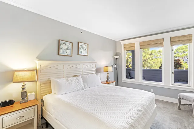 a bathroom with a tub sink shower and mirror