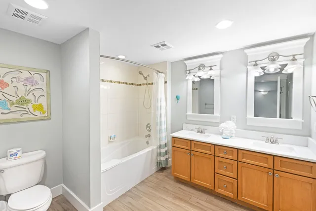 a bedroom with a bed and ceiling fan