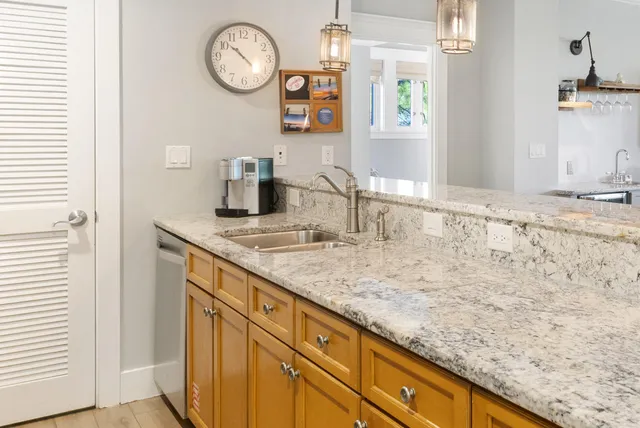 a view of a dining room with furniture wooden floor and a chandelier