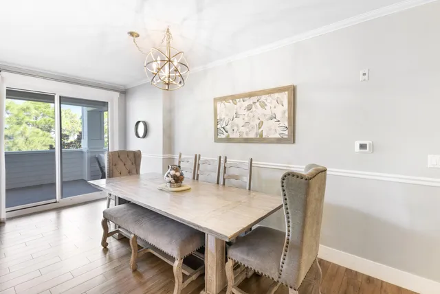 a living room with furniture fireplace and a table