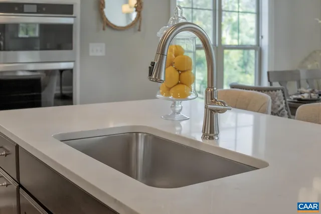 a vase of white flowers sitting on a table