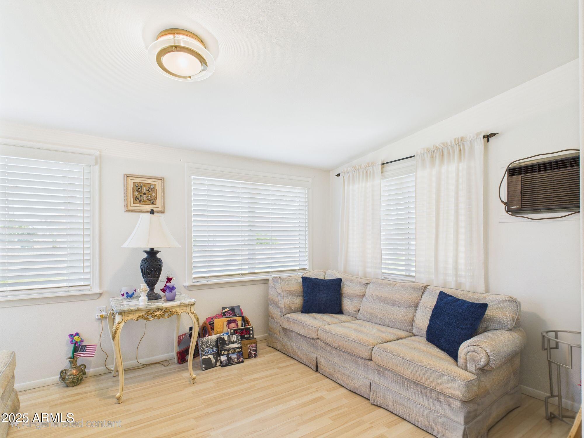 9915 West Mountain View Road Sun City, AZ 85351 - Photo 17 of 22 a living room with furniture and a window