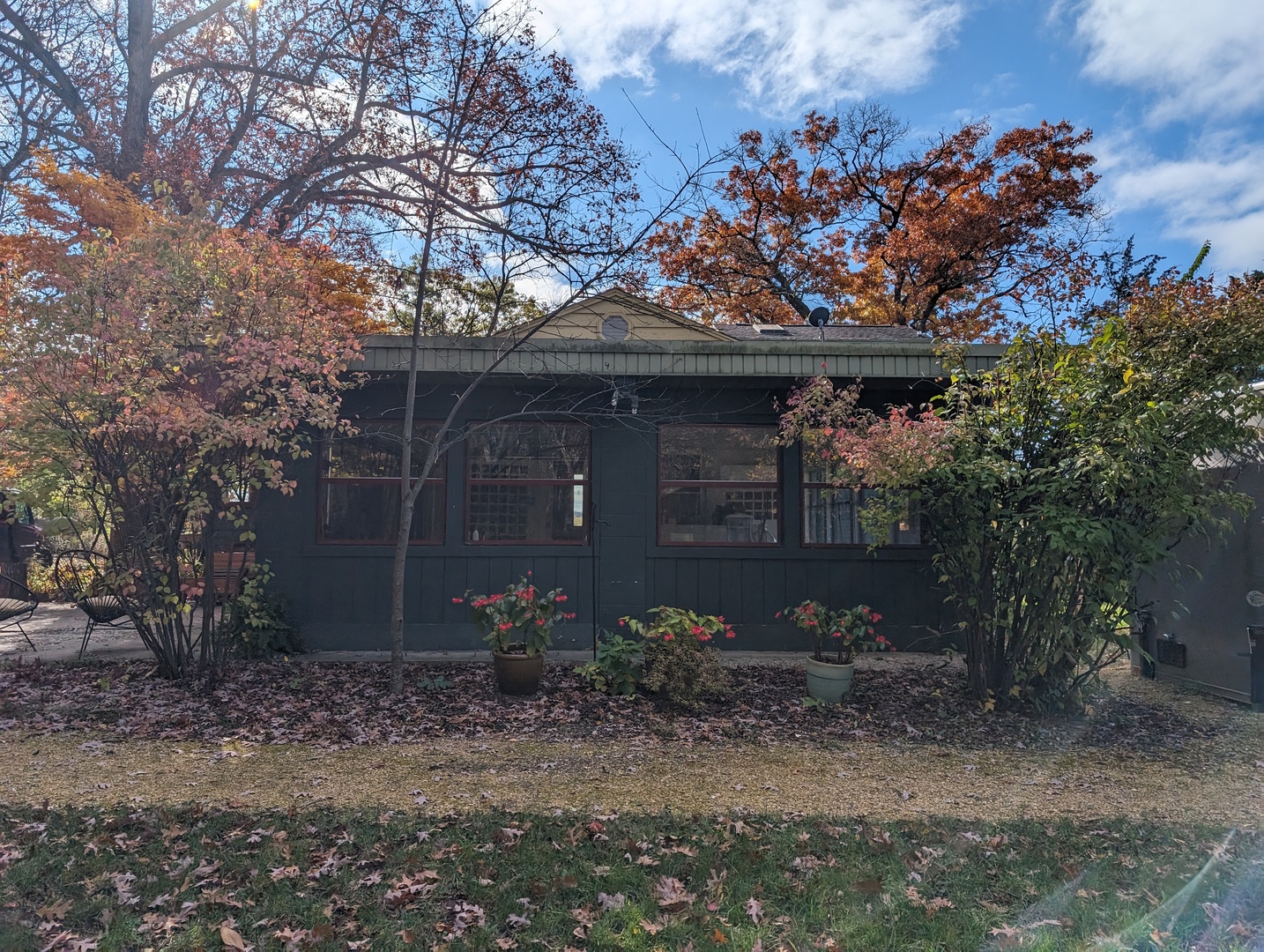 1950 North River Road Oregon, IL 61061 - Photo 3 of 13 a front view of a house with plants and trees