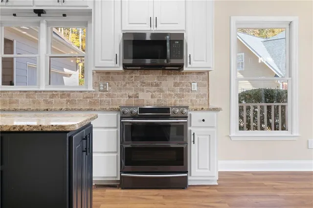 a view of storage and utility room with washer and dryer