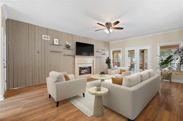 a living room with furniture and kitchen view